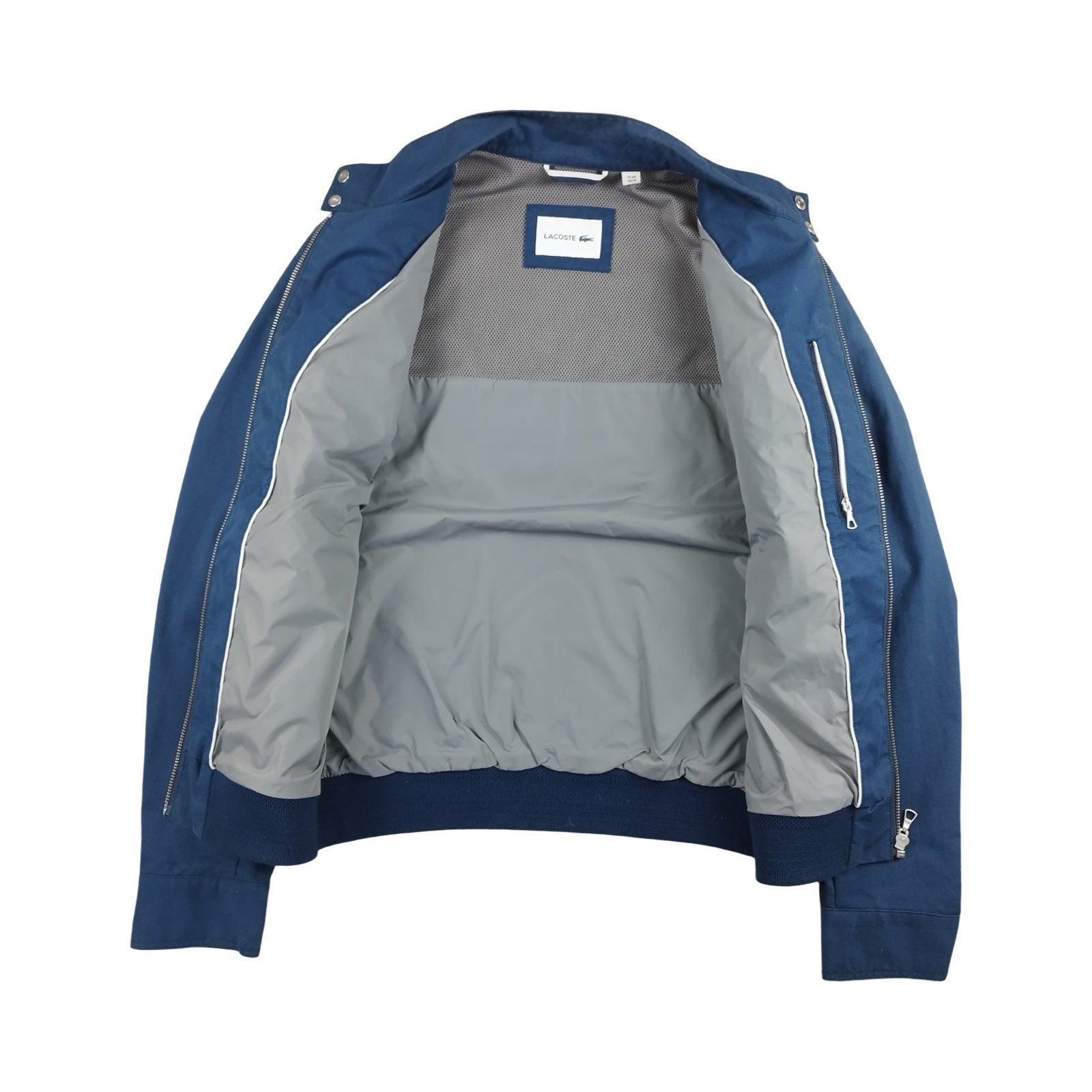 Lacoste - Blouson léger bleu taille XS - Le Saptuaire